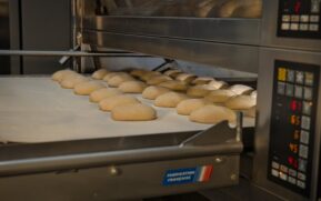 Artisan bread baking in an industrial oven at a bakery in Berlin, Germany. Fresh and delicious. - Photo by Travel with Lenses on Pexels