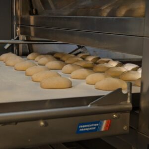 Artisan bread baking in an industrial oven at a bakery in Berlin, Germany. Fresh and delicious. - Photo by Travel with Lenses on Pexels