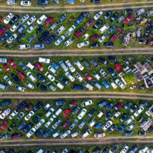 Top view of a busy scrapyard in Saint Charles filled with rows of abandoned vehicles and metal parts. - Photo by Tom Fisk on Pexels