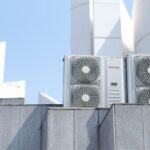 Air conditioner units on a city rooftop in Bandung, Indonesia, showcasing modern urban architecture. - Photo by Mesayu Elida Irawati on Pexels